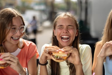 girls eating burgers